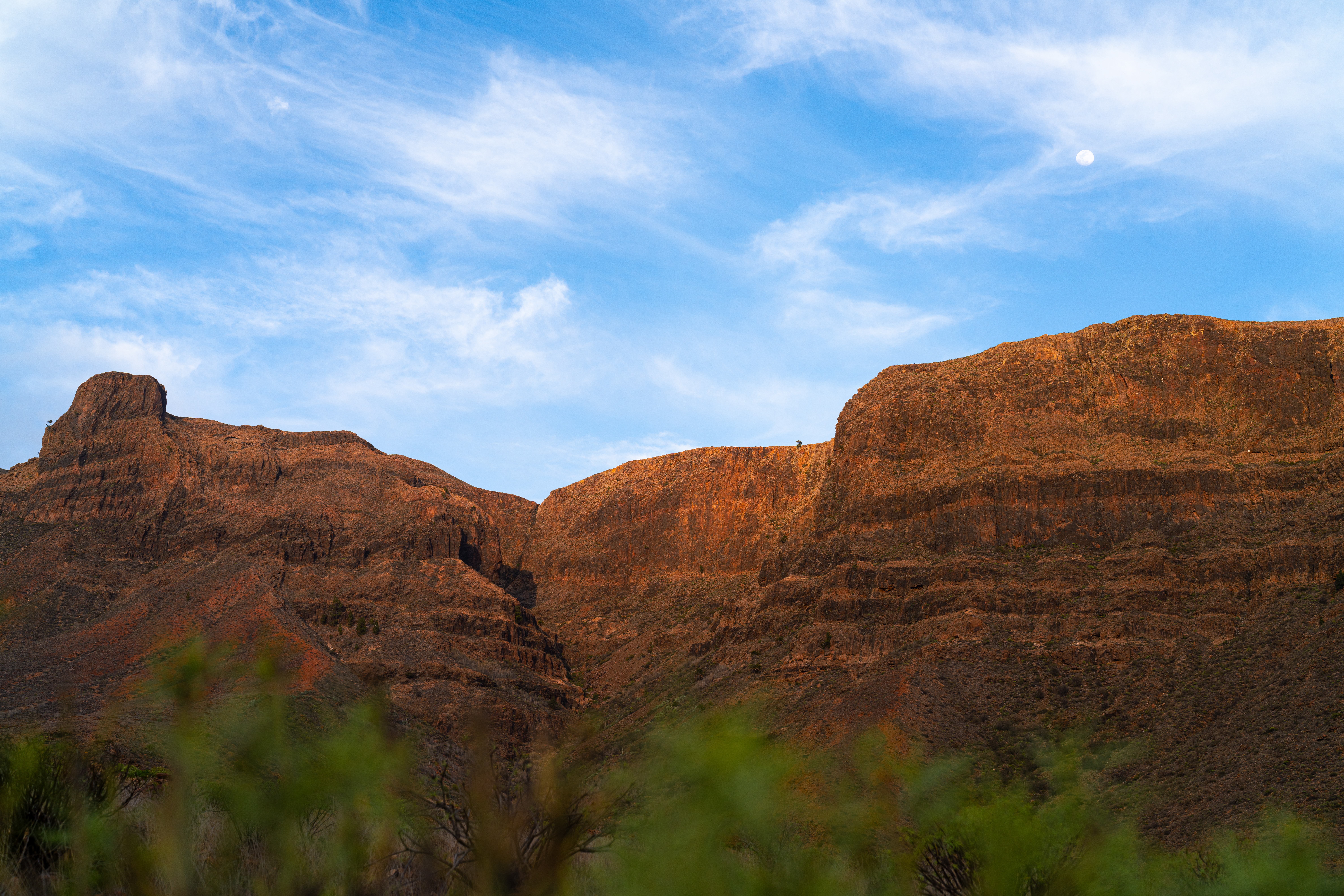 Layers of volcanic rock glowing in the late evening light.